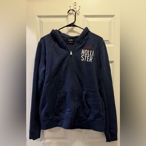 Hollister Navy Zip-Up Hoodie with White Logo and Red Accent